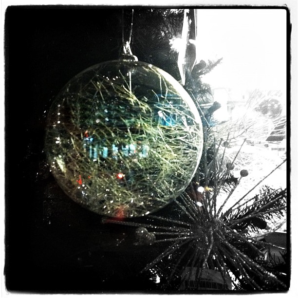 glass ornament hanging in shop window