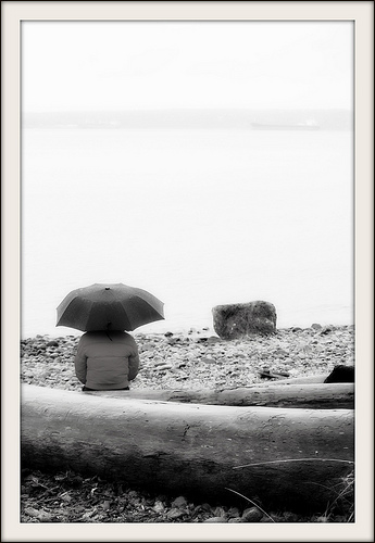 Umbrella Head: photo credit - Mark Faviell sitting on the beach in West Vancouver