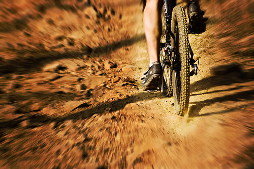 Dust: photo credit - Mark Grapengater mountain bike on red dirt road