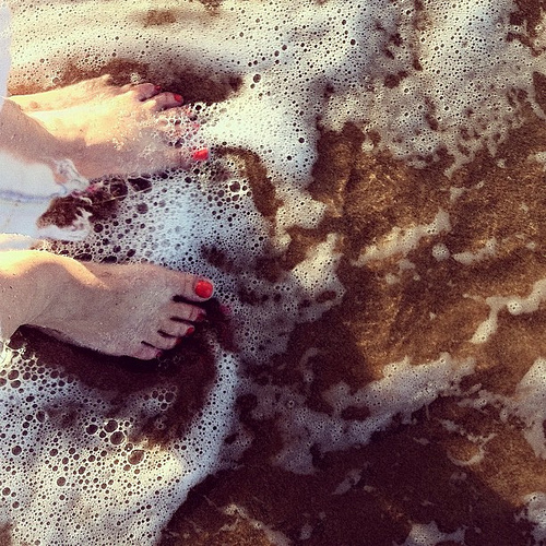 Greeting the Pacific: photo credit waves reaching toes, Kihei, Maui