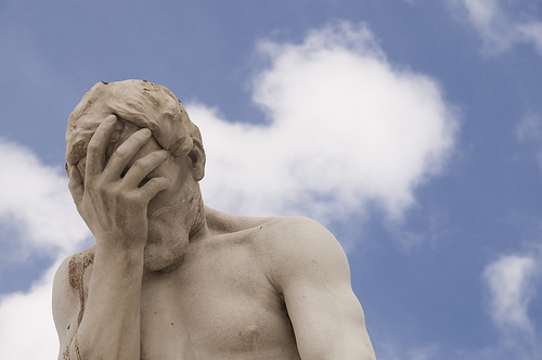 Denial: photo credit - Cesar Astudillo regretful pose of sculpture against blue sky