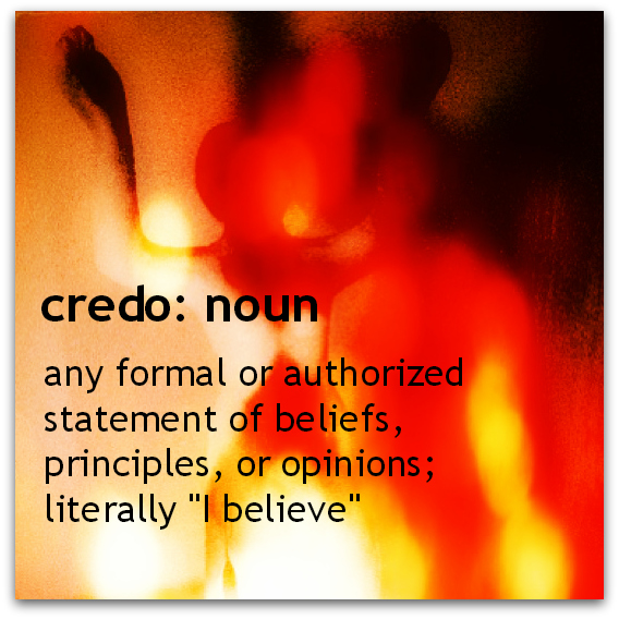 definition of credo against burning background