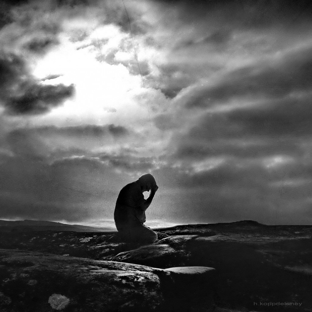 Guilt: photo credit - Hartwig HKD photo of figure against turbulent black and white sky by Hartwig HKD